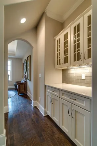 a living room with fireplace furniture and a large window