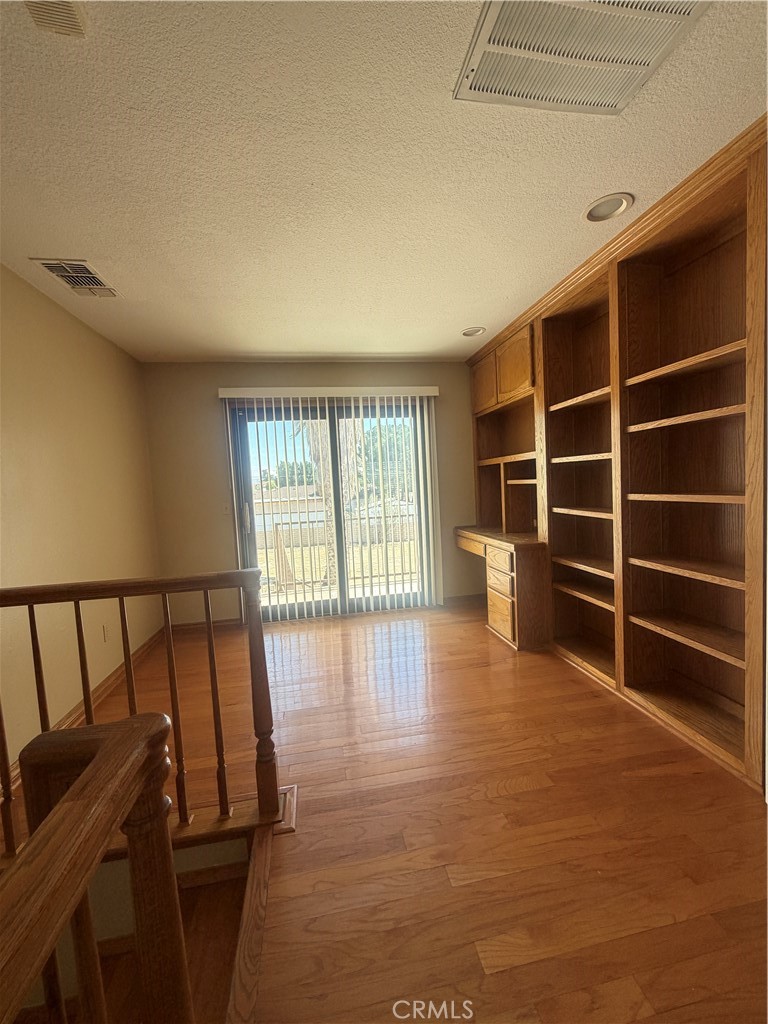 19609 Seneca Road Apple Valley, CA 92307 - Photo 19 of 37 a view of an empty room with a window