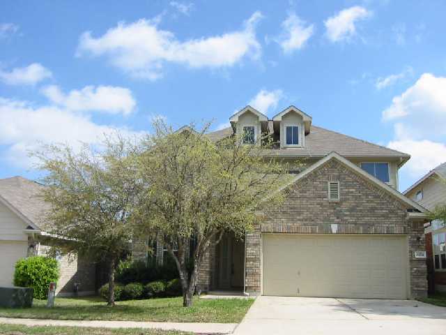 3408 Bratton Ridge Crossing Austin, TX 78728 - Photo 1 of 1 a front view of a house with a yard