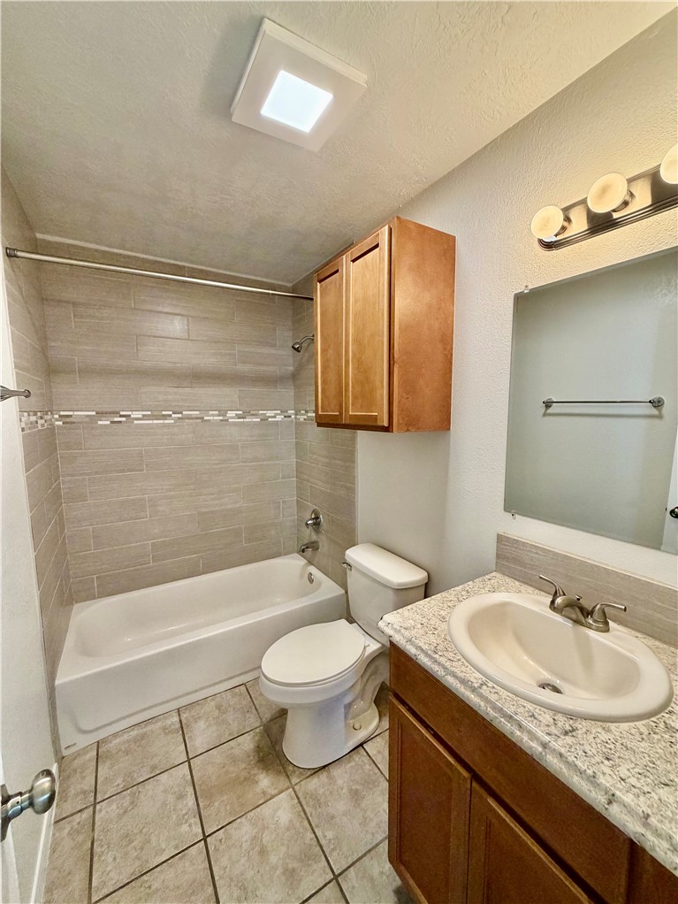 1900-1910 Finfeather Road Bryan, TX 77801 - Photo 14 of 20 a bathroom with a sink a toilet and shower
