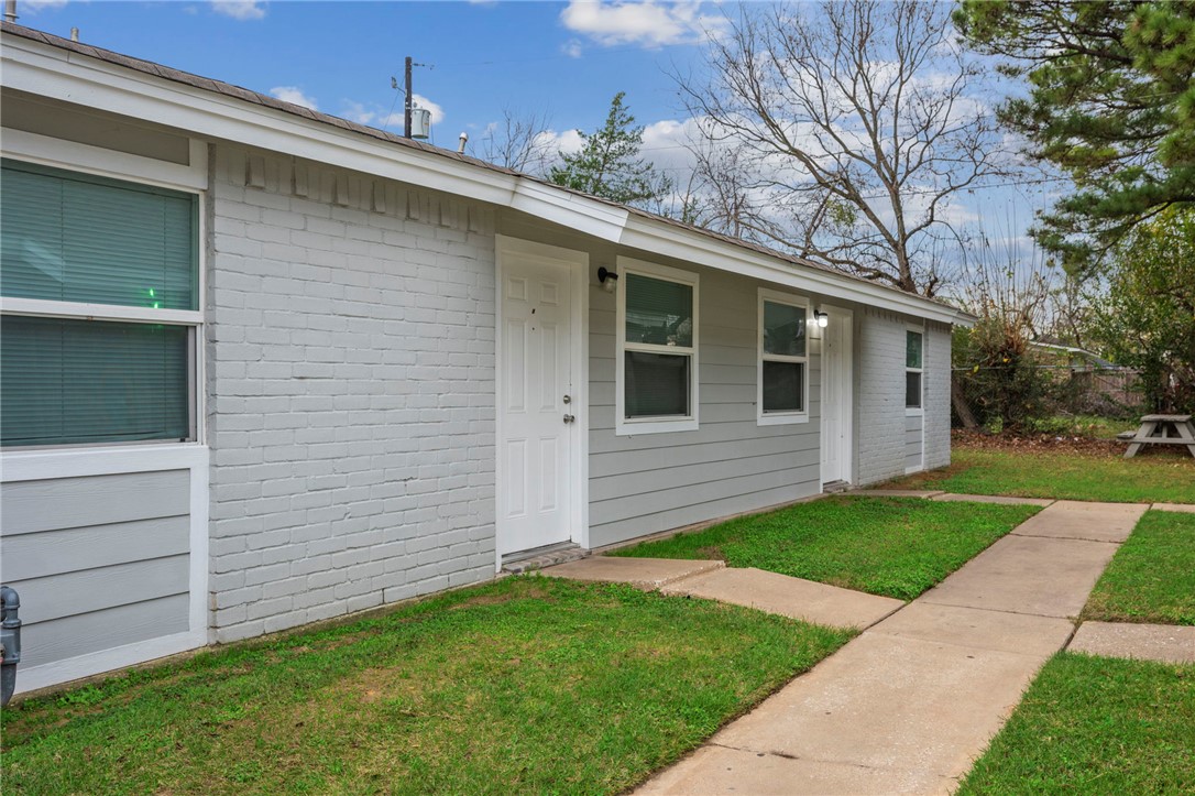 1900-1910 Finfeather Road Bryan, TX 77801 - Photo 6 of 20 a front view of house with yard
