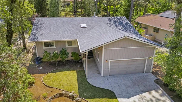 aerial view of house with a yard
