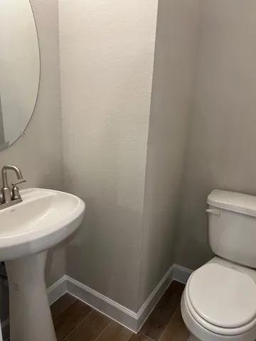 a bathroom with a double vanity sink mirror and shower