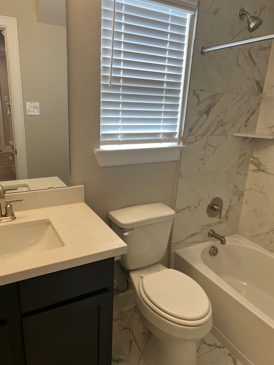 3316 Vine Ter Trace Houston, TX 77047 - Photo 7 of 18 a bathroom with a sink a toilet and bathtub