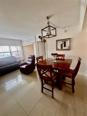 a living room with furniture toys and a flat screen tv