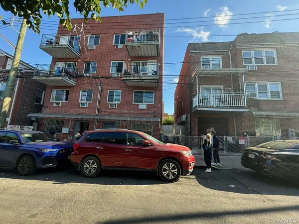 a view of a car parked in front of a building