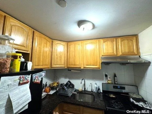 a kitchen with furniture and window