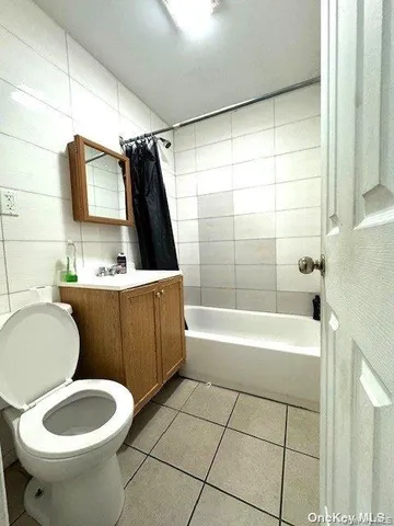 a bathroom with a sink a toilet and bathtub