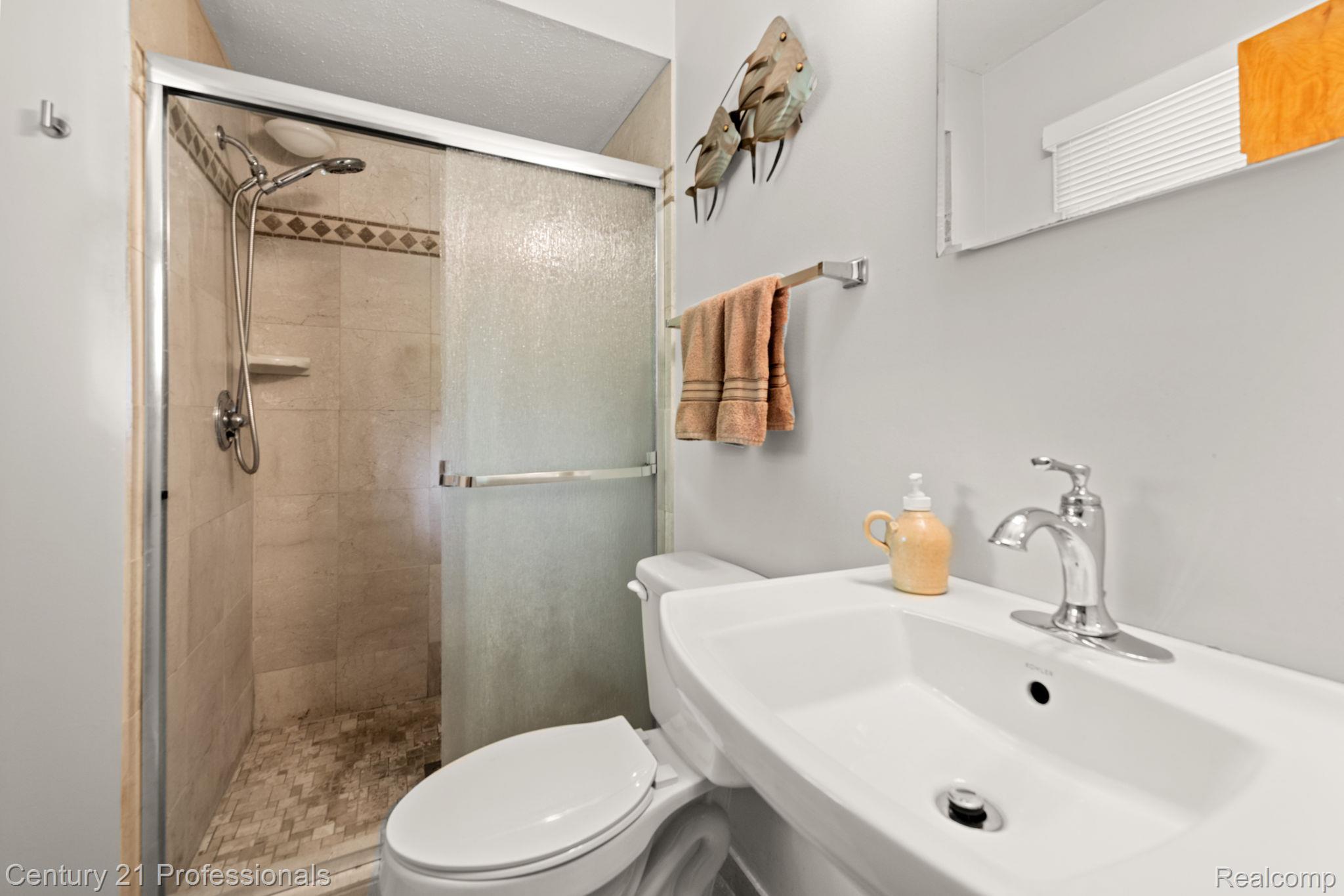 8638 Stone Road Algonac, MI 48001 - Photo 27 of 70 Full bath with a shower stall and toilet