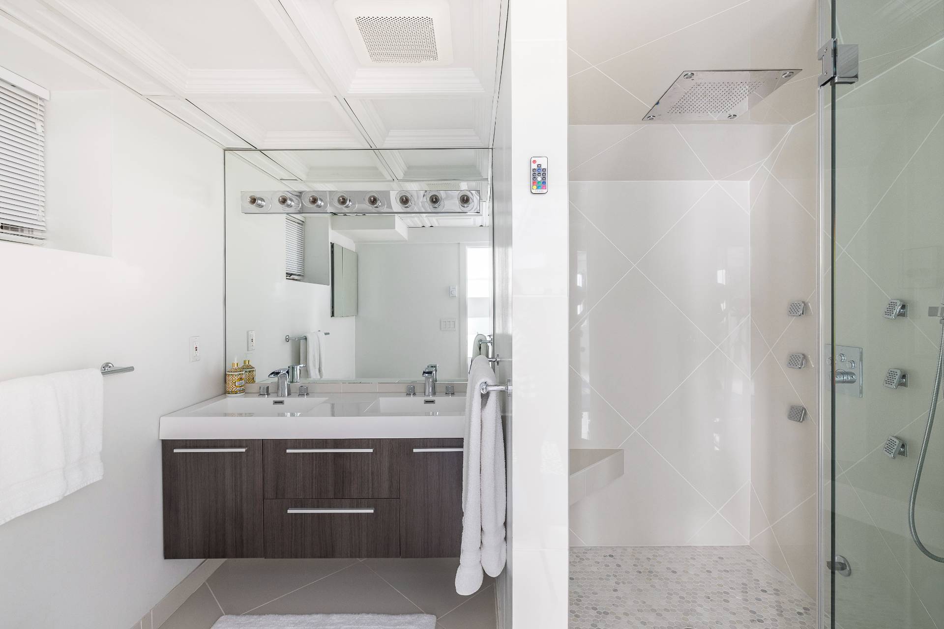 24 South Potato Barn Road Water Mill, NY 11976 - Photo 38 of 42 a bathroom with a double vanity sink mirror and shower