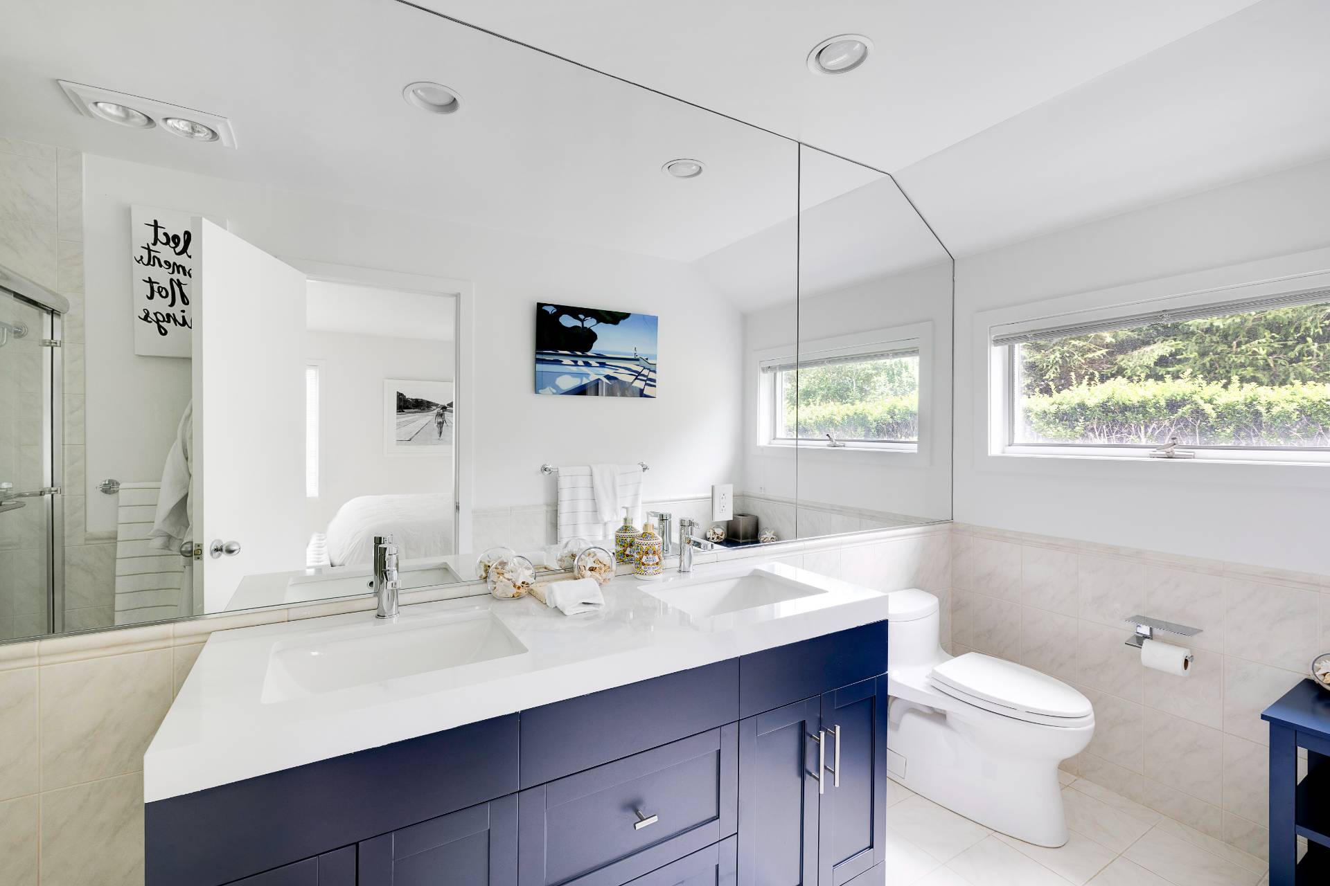 24 South Potato Barn Road Water Mill, NY 11976 - Photo 39 of 42 a bathroom with a sink a toilet a mirror and shower