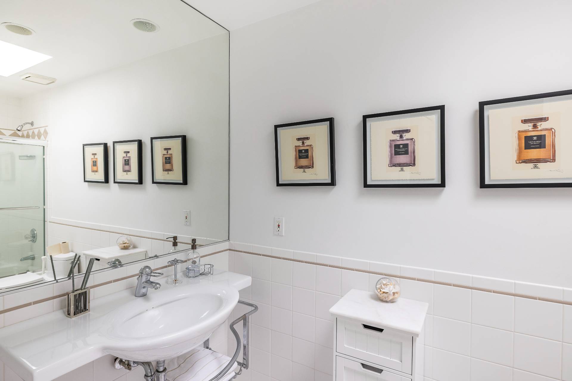 24 South Potato Barn Road Water Mill, NY 11976 - Photo 40 of 42 a bathroom with a sink and a mirror