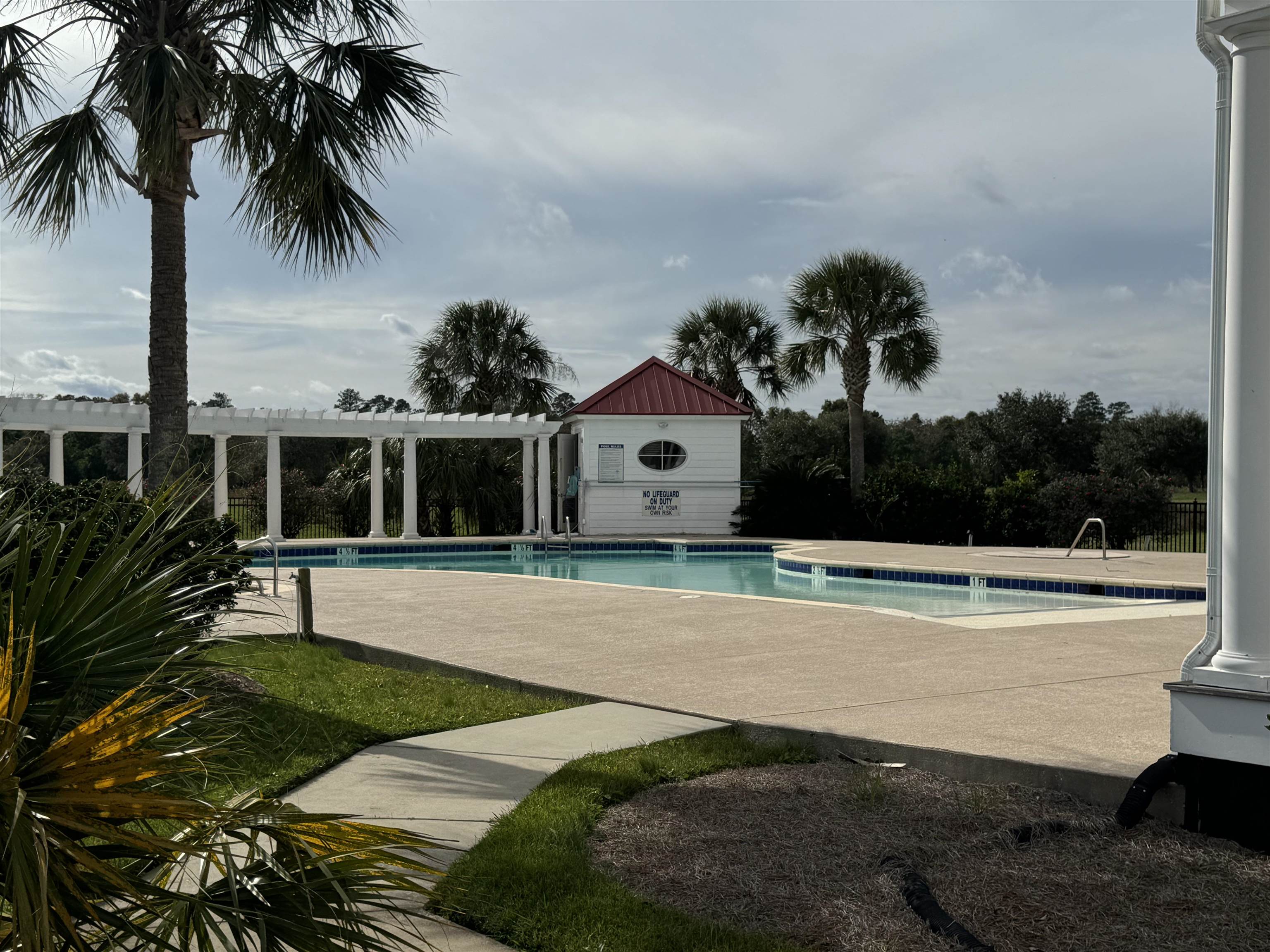Lot 7 Cravens Grant Georgetown, SC 29440 - Photo 19 of 19 Community pool featuring a patio area