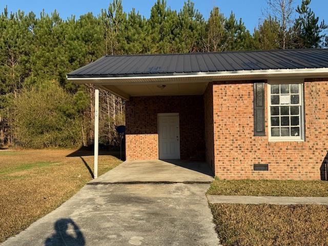 40 Sampson Road Hemingway, SC 29554 - Photo 2 of 12 View of parking with driveway and a carport