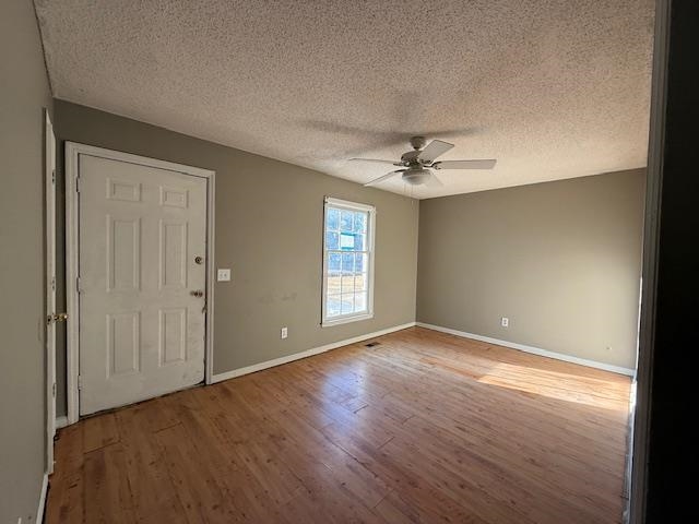 40 Sampson Road Hemingway, SC 29554 - Photo 4 of 12 Spare room with a textured ceiling, light wood-type flooring, and ceiling fan
