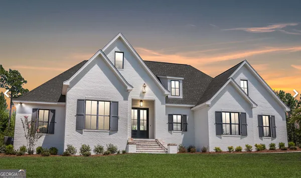 front view of a house with a yard