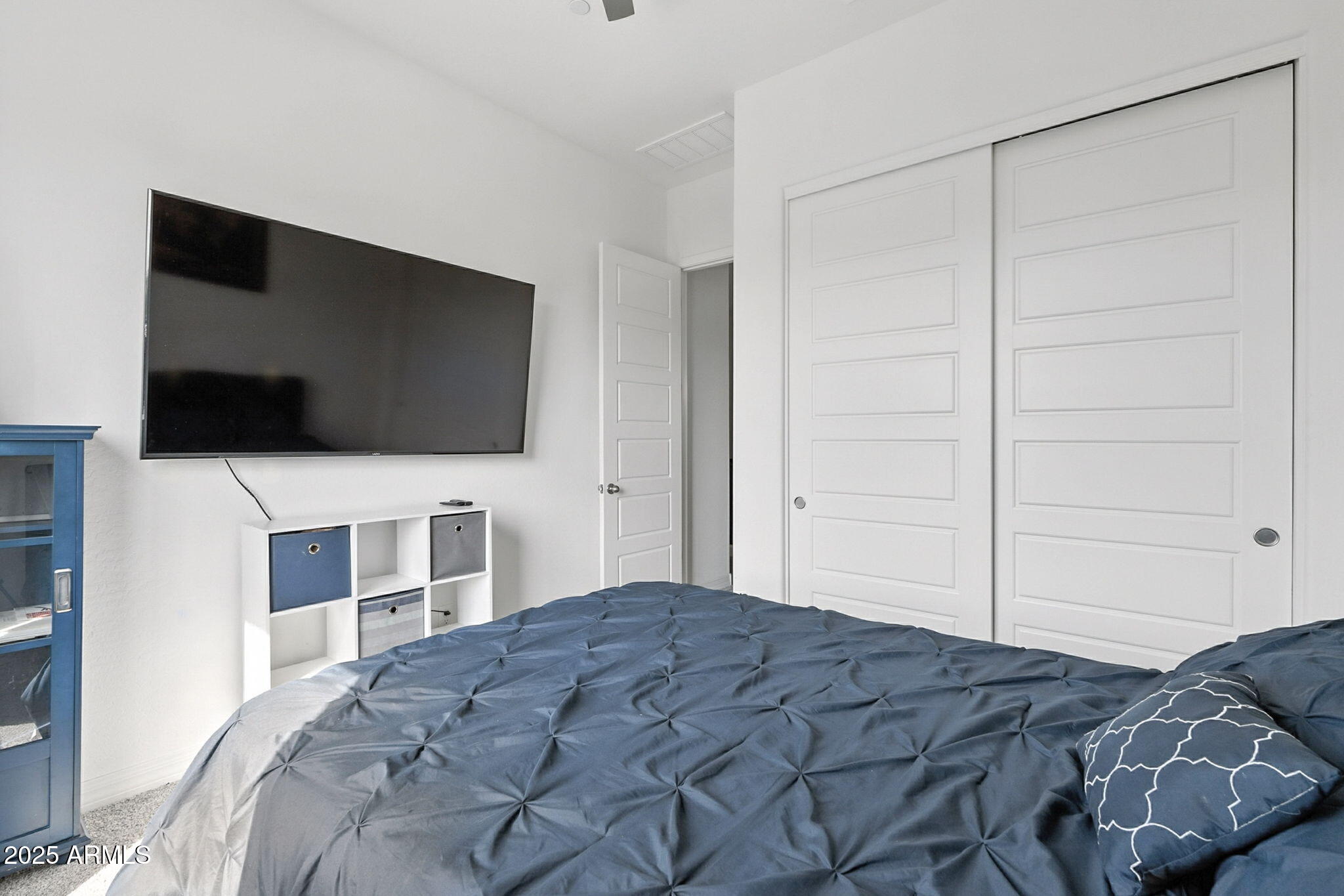 7236 West Phelps Road Peoria, AZ 85382 - Photo 29 of 53 a bedroom with a bed and a flat screen tv