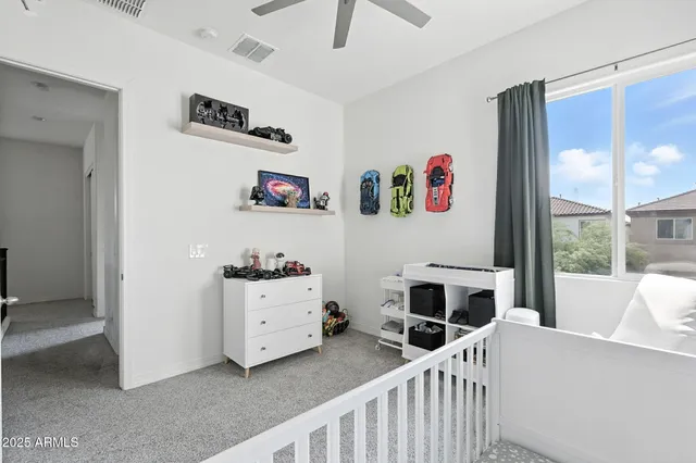 a bedroom with furniture and a window