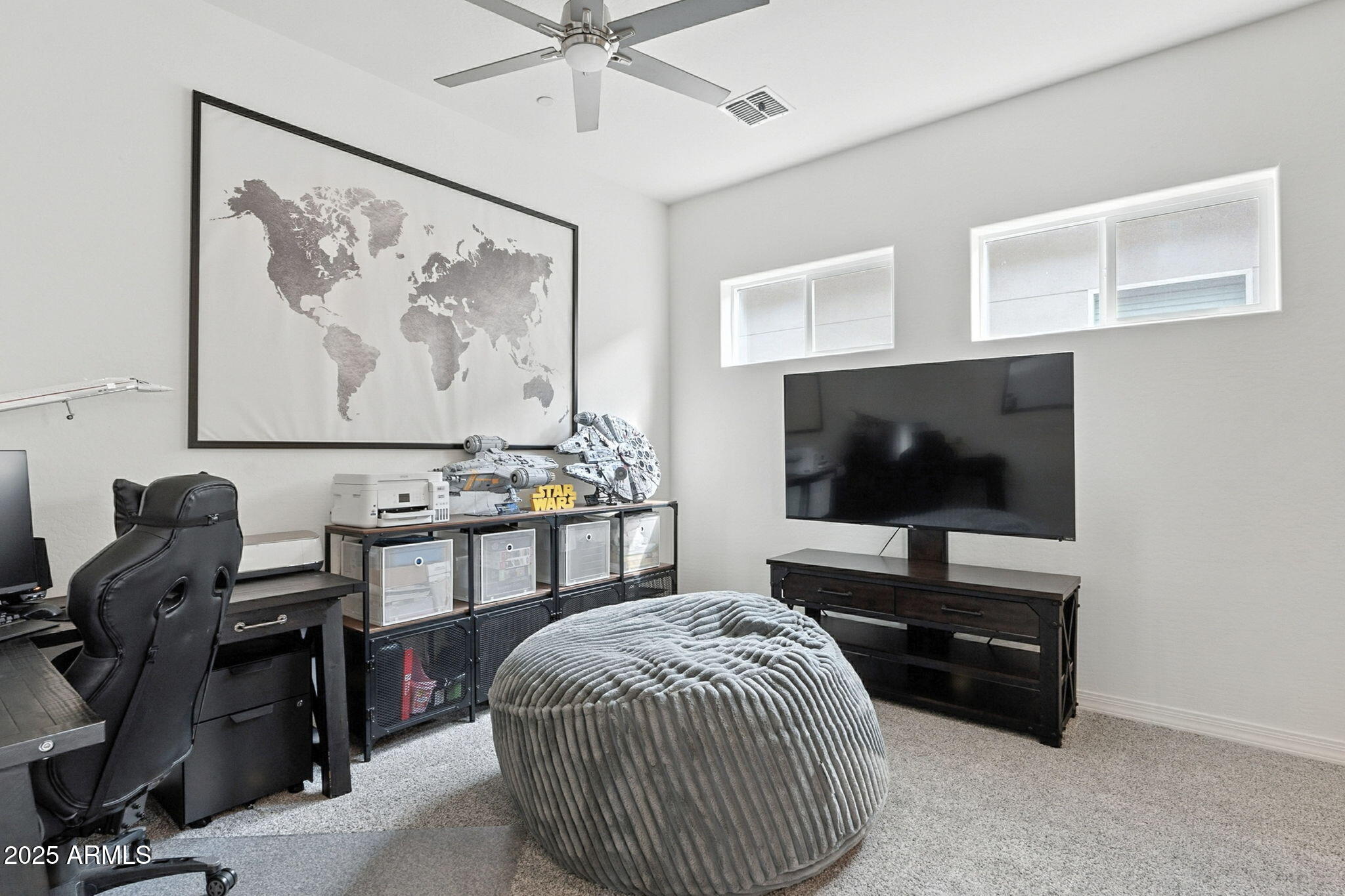 7236 West Phelps Road Peoria, AZ 85382 - Photo 34 of 53 a living room with furniture and a flat screen tv