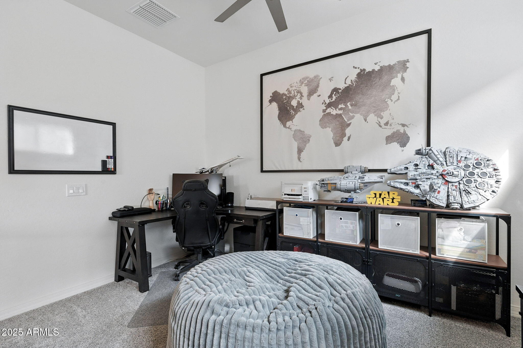 7236 West Phelps Road Peoria, AZ 85382 - Photo 35 of 53 a bedroom with a bed and painting on the wall