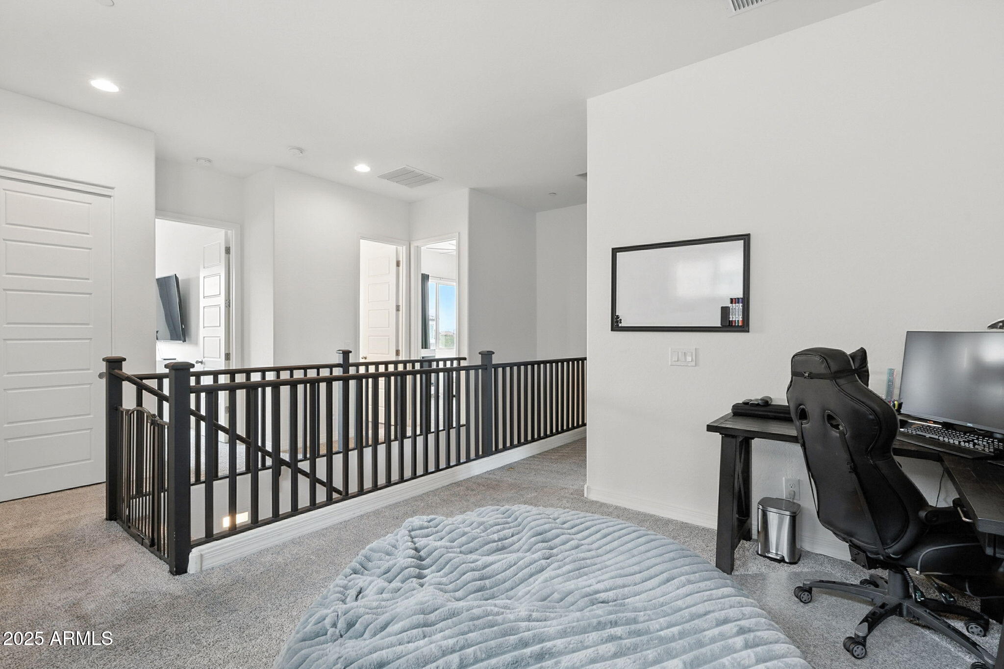 7236 West Phelps Road Peoria, AZ 85382 - Photo 36 of 53 a view of a workspace with furniture and windows