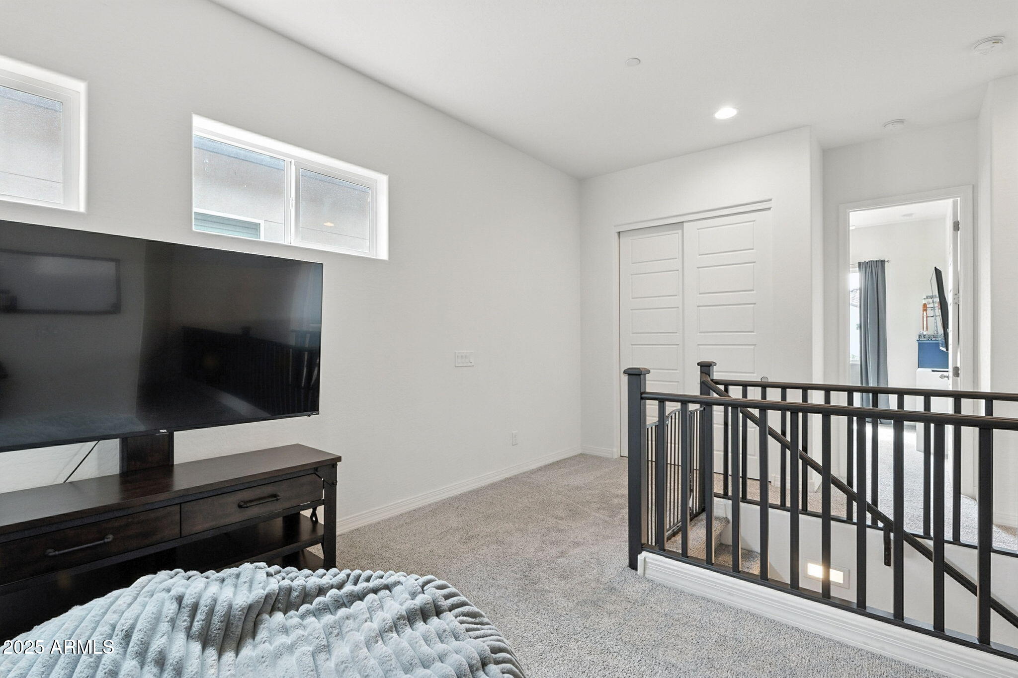 7236 West Phelps Road Peoria, AZ 85382 - Photo 37 of 53 a bedroom with a bed and television