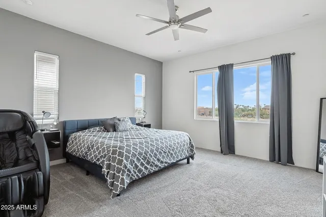 a bedroom with a bed and window