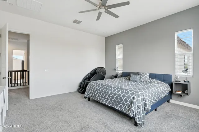 a bedroom with a bed and flat screen tv