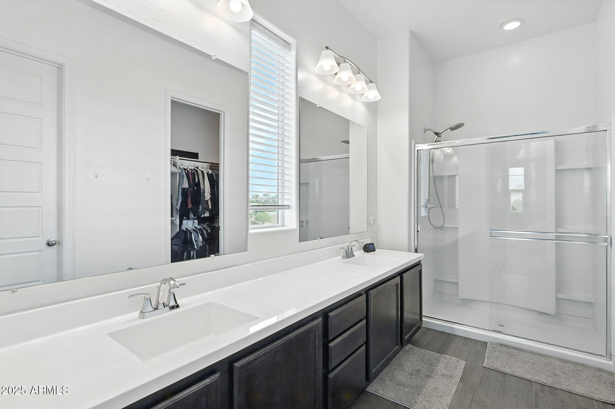 7236 West Phelps Road Peoria, AZ 85382 - Photo 42 of 53 a bathroom with a double vanity sink mirror and shower