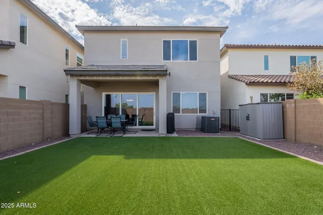 a view of a backyard with grass