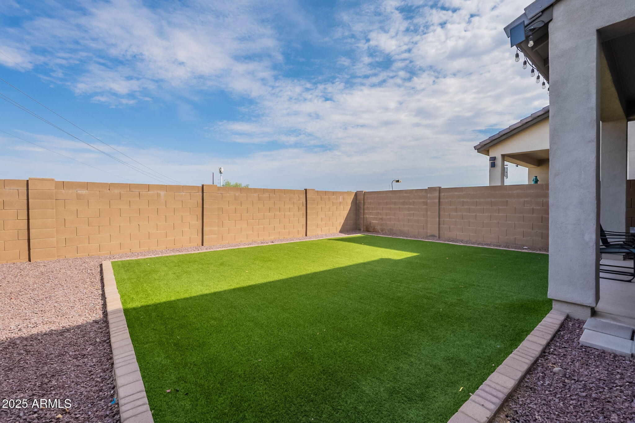 7236 West Phelps Road Peoria, AZ 85382 - Photo 50 of 53 a view of a backyard with sitting area