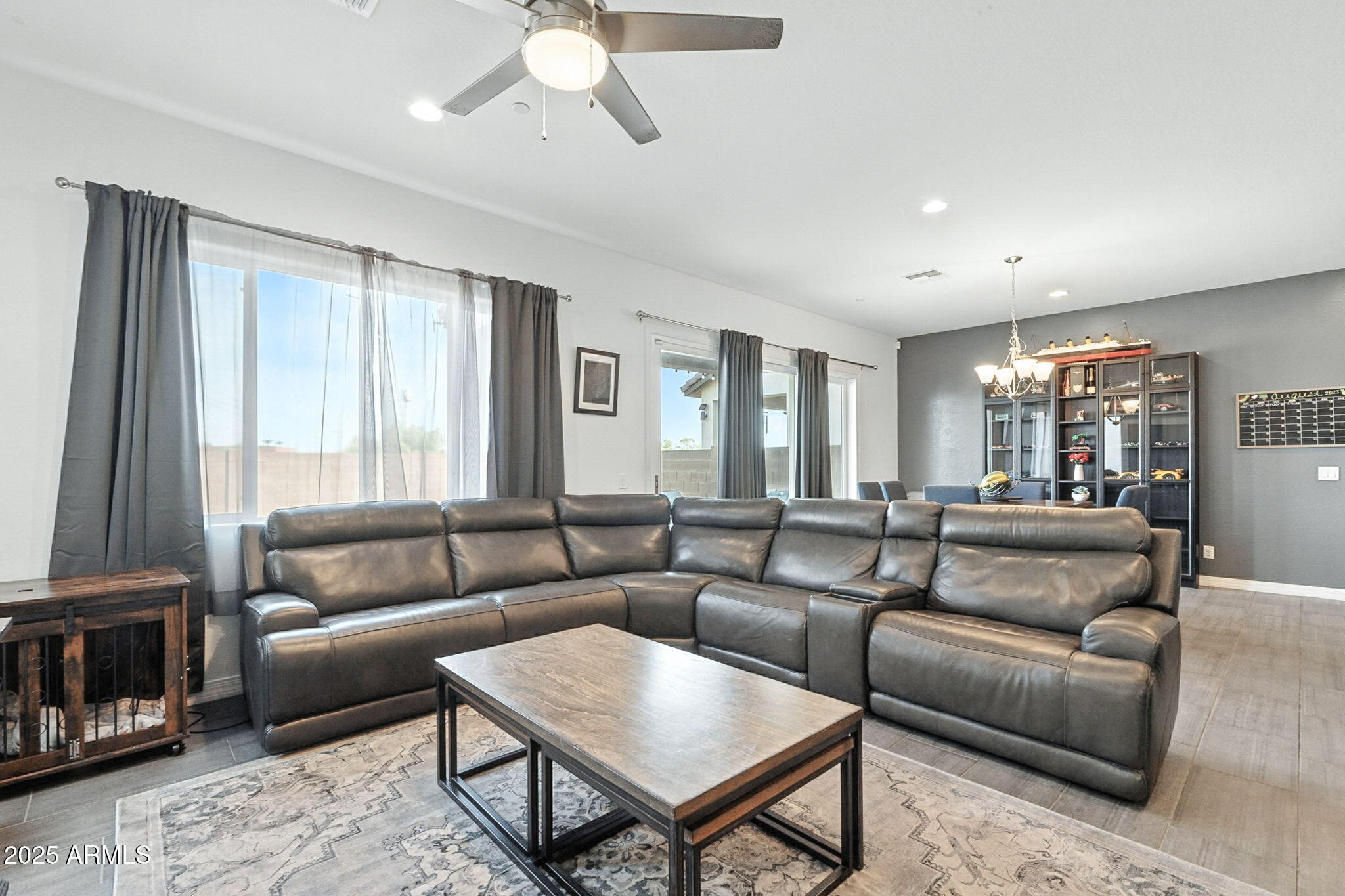 7236 West Phelps Road Peoria, AZ 85382 - Photo 9 of 53 a living room with furniture and a large window