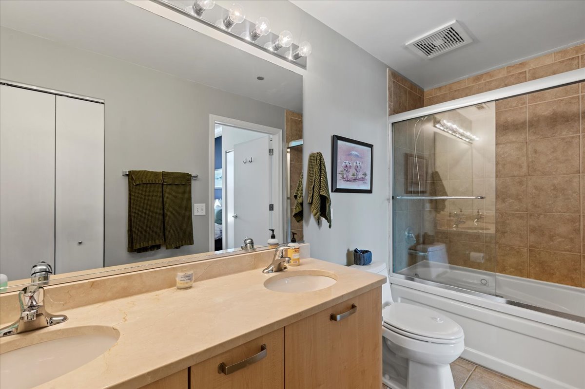 111 South Morgan Street, Unit 823 Chicago, IL 60607 - Photo 14 of 20 a bathroom with a granite countertop sink toilet and shower