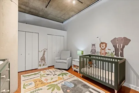 a bedroom with furniture and a window