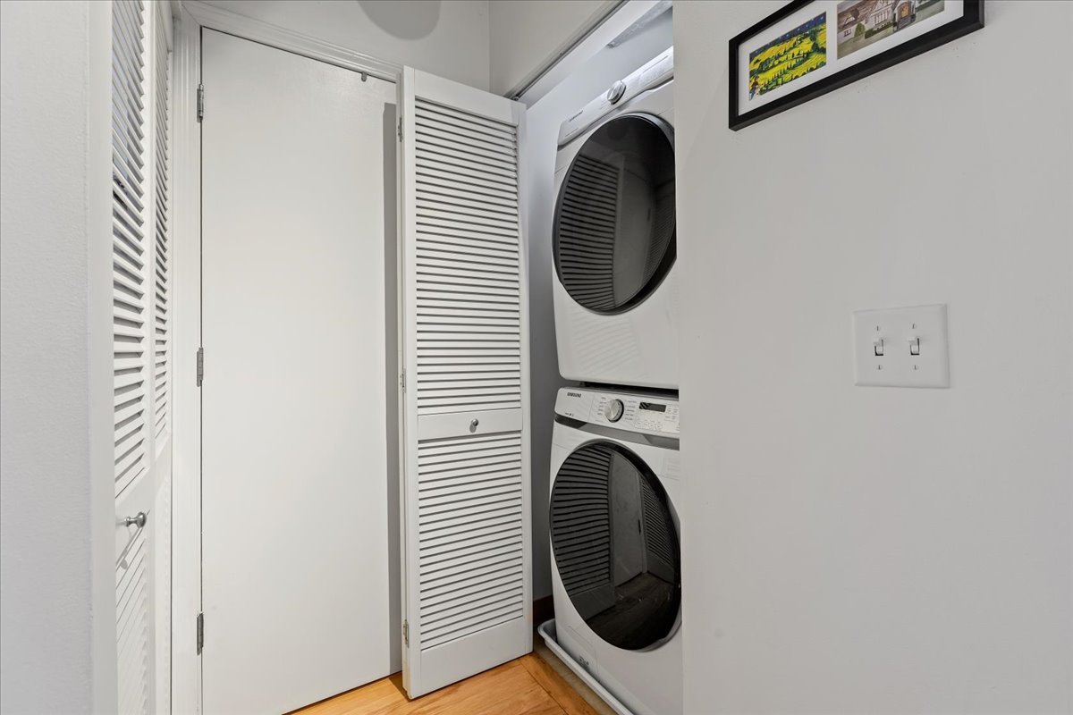 111 South Morgan Street, Unit 823 Chicago, IL 60607 - Photo 18 of 20 a view of a hallway with washer and dryer