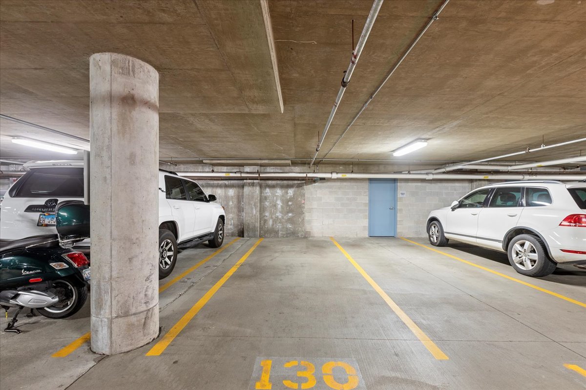 111 South Morgan Street, Unit 823 Chicago, IL 60607 - Photo 19 of 20 a view of parking garage with cars parked