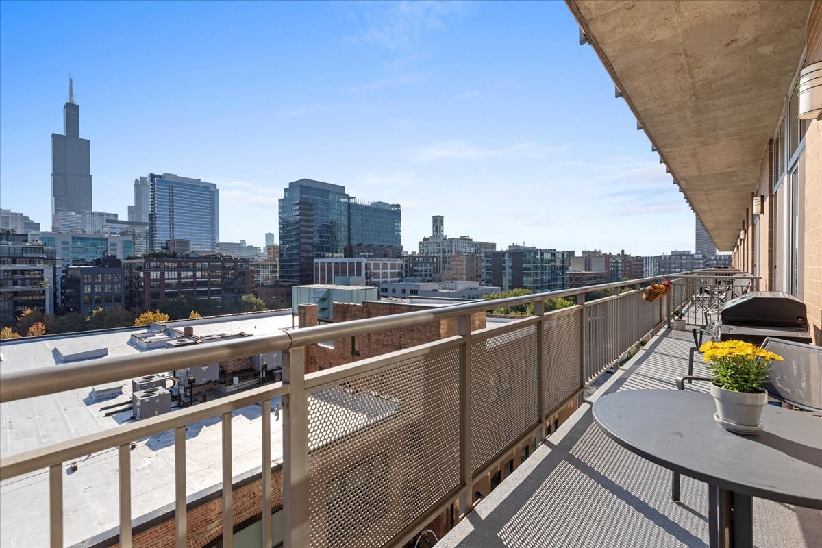 111 South Morgan Street, Unit 823 Chicago, IL 60607 - Photo 7 of 20 a view of city from terrace along with seating space