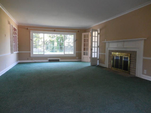 5159 Spring Creek Road Rockford, IL 61114 - Photo 5 of 25 a view of empty room with a fireplace