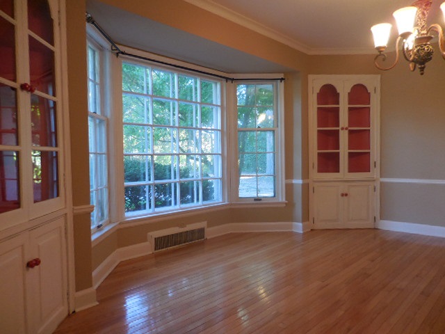 5159 Spring Creek Road Rockford, IL 61114 - Photo 8 of 25 a view of an empty room with wooden floor and a window
