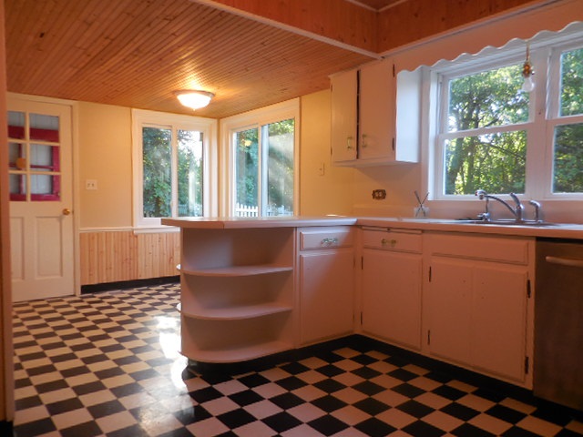 5159 Spring Creek Road Rockford, IL 61114 - Photo 10 of 25 a room with a black white checkered floor with a black white checkered floor