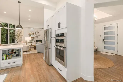 a kitchen with stainless steel appliances a refrigerator and a stove top oven