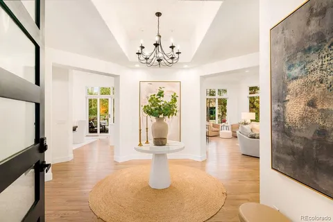 a lobby with furniture and wooden floor