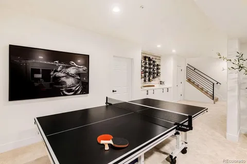 a room with stainless steel appliances furniture and a large window