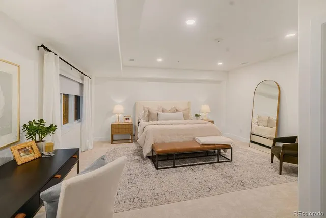 a bedroom with a bed and a couch