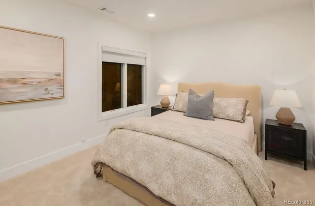 a view of a bedroom with closet and cabinet