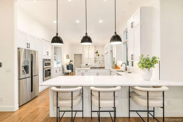 a kitchen with a sink stove and cabinets