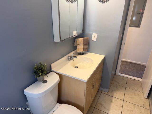8114 Fresca Street Jacksonville, FL 32217 - Photo 14 of 29 a bathroom with a sink toilet and mirror