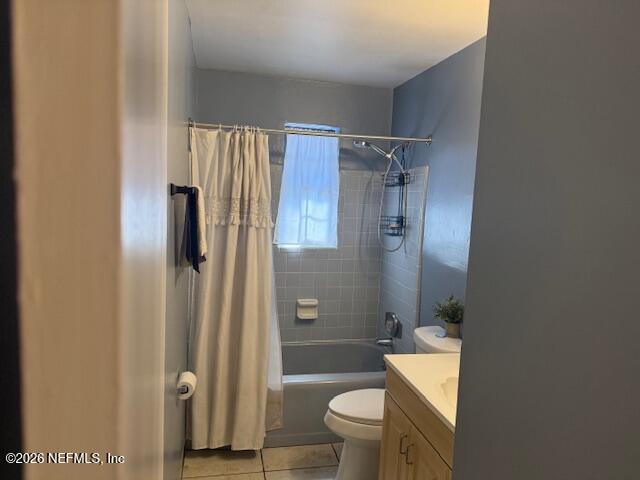 8114 Fresca Street Jacksonville, FL 32217 - Photo 15 of 29 a bathroom with a granite countertop toilet sink and shower