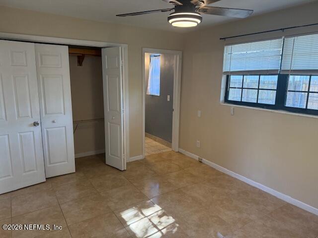 8114 Fresca Street Jacksonville, FL 32217 - Photo 17 of 29 an empty room with chandelier fan