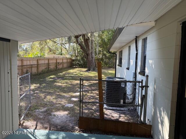 8114 Fresca Street Jacksonville, FL 32217 - Photo 27 of 29 a view of a porch with a table and chairs